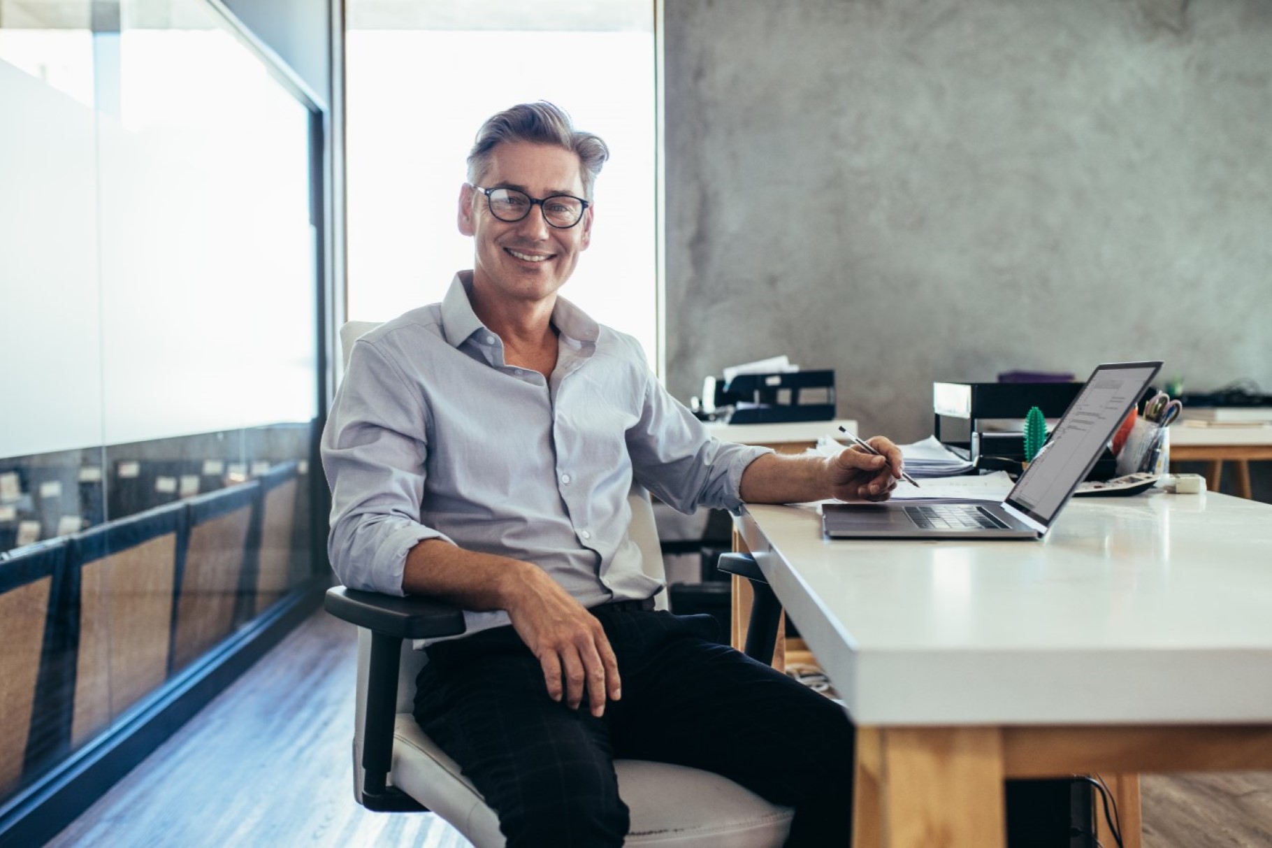 Mid adult businessman at work